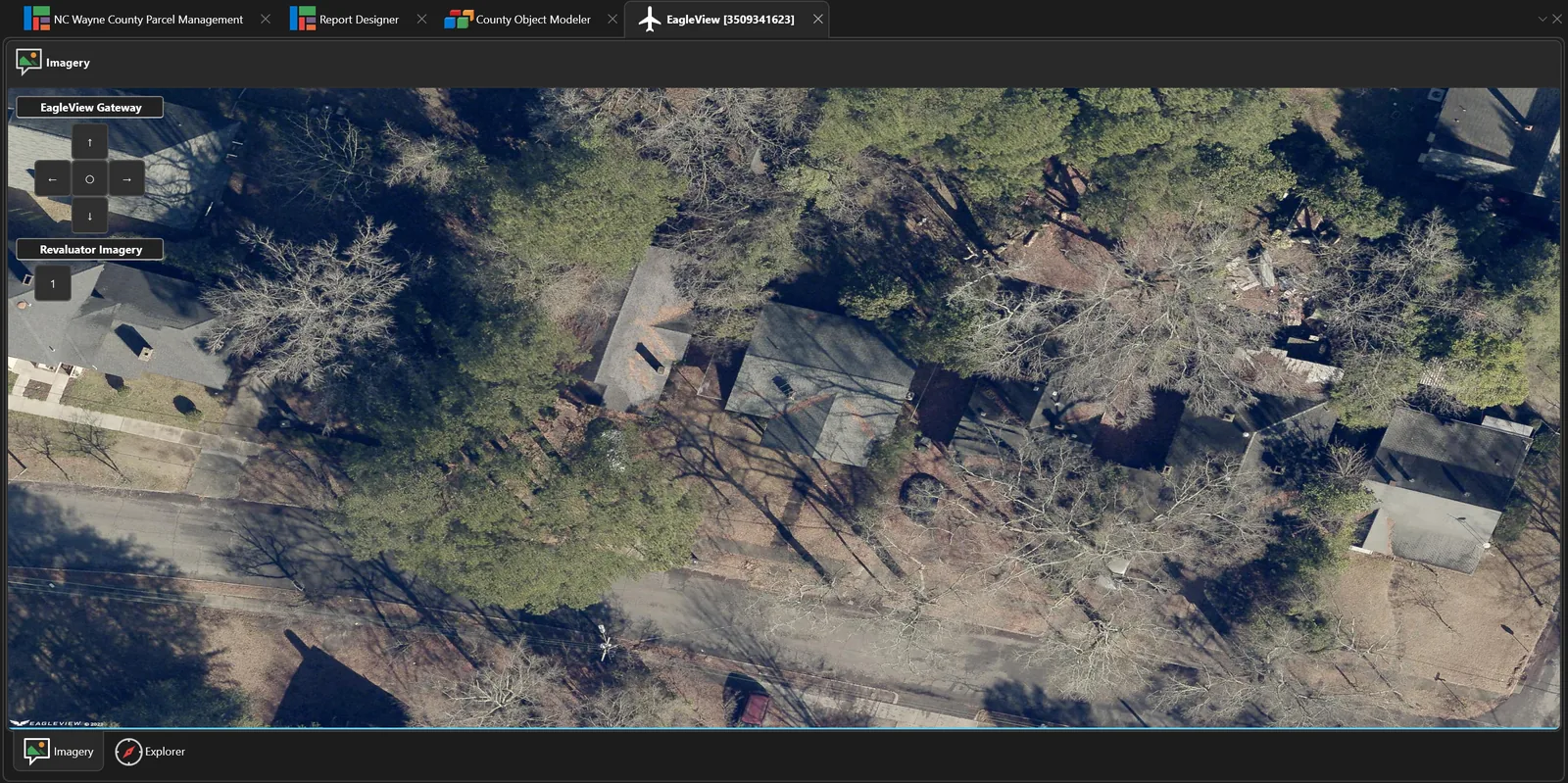 Oblique aerial imagery of residential rooftops and tree cover displayed inside the EagleView integration panel.