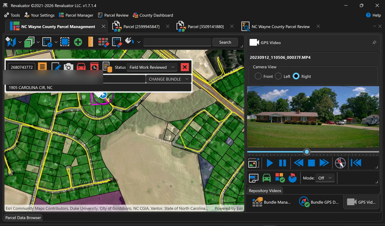 GPS video panel playing street-level footage of a brick house beside a parcel map, with playback controls and a camera view selector for front, left and right.
